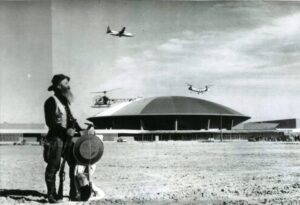 W. R. "Smiley" Washburn, a prospector, watches aircraft above LVCC