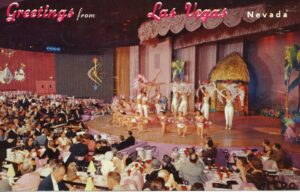 Venus Room - the stage and dining room of the New Frontier with a performance of dancers while diners watch